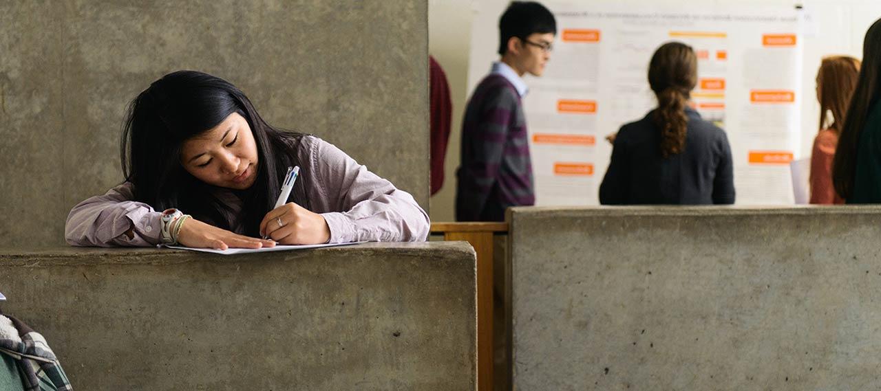 A student filling out paperwork