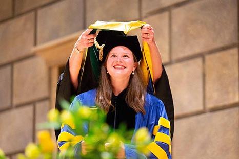 A woman receiving honors at commencement.