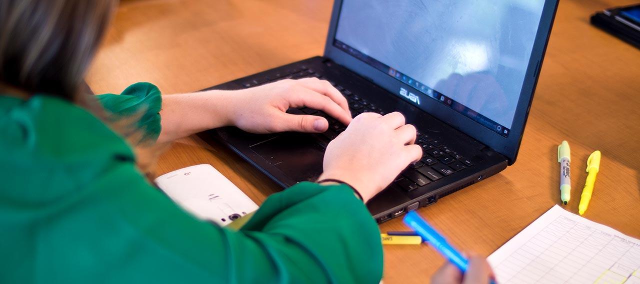 A student working on a computer.