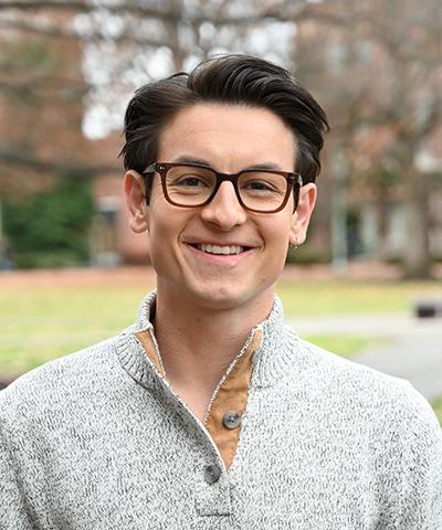 Headshot of Ben Godfrey.